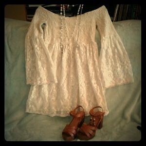 White bell sleeved lace dress